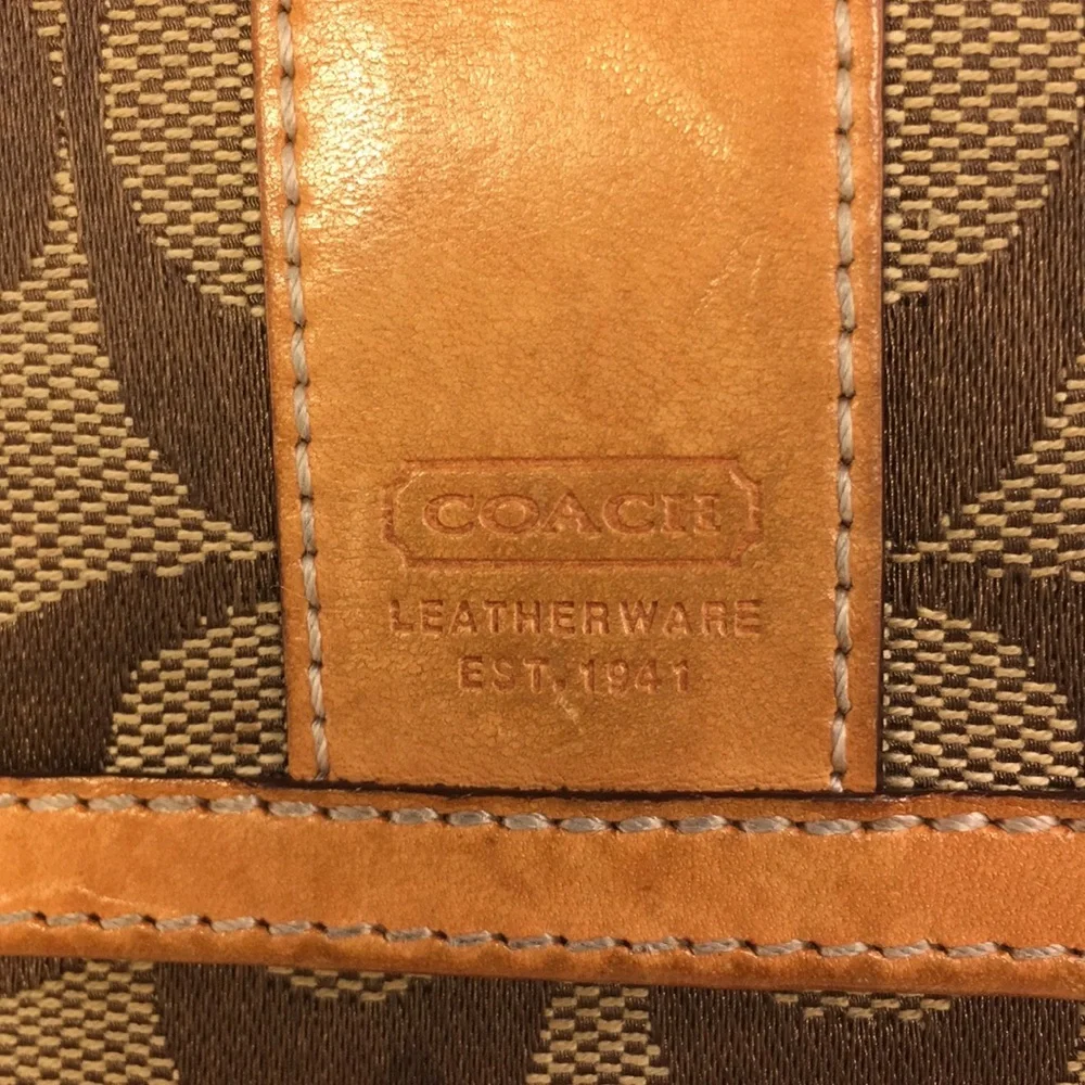 Coach leather/monogrammed canvas iconic wallet